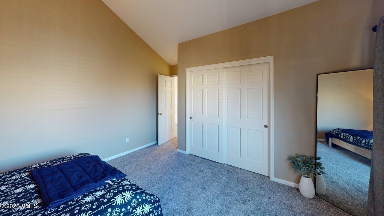8958 South Forrest Drive Littleton, CO 80126 - Photo 12 of 27 a bedroom with a bed and a potted plant