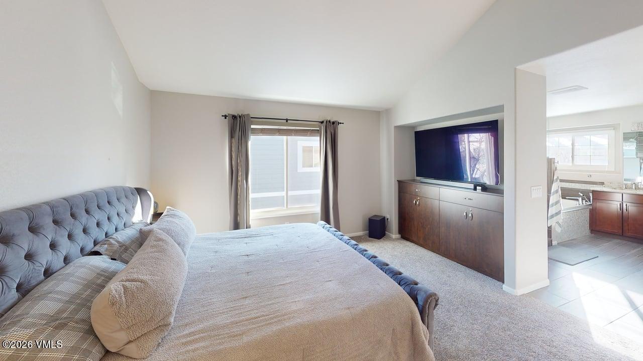 8958 South Forrest Drive Littleton, CO 80126 - Photo 13 of 27 a bed room with a bed and a couch