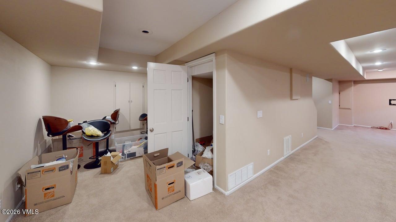 8958 South Forrest Drive Littleton, CO 80126 - Photo 27 of 27 a room with furniture and white walls