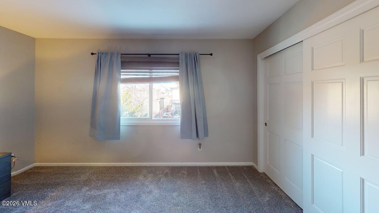 8958 South Forrest Drive Littleton, CO 80126 - Photo 7 of 27 a view of an empty room with a window
