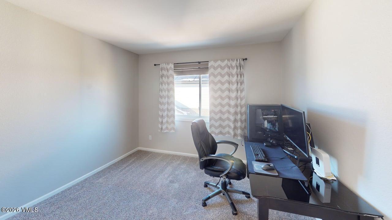 8958 South Forrest Drive Littleton, CO 80126 - Photo 8 of 27 a workspace with furniture and a window