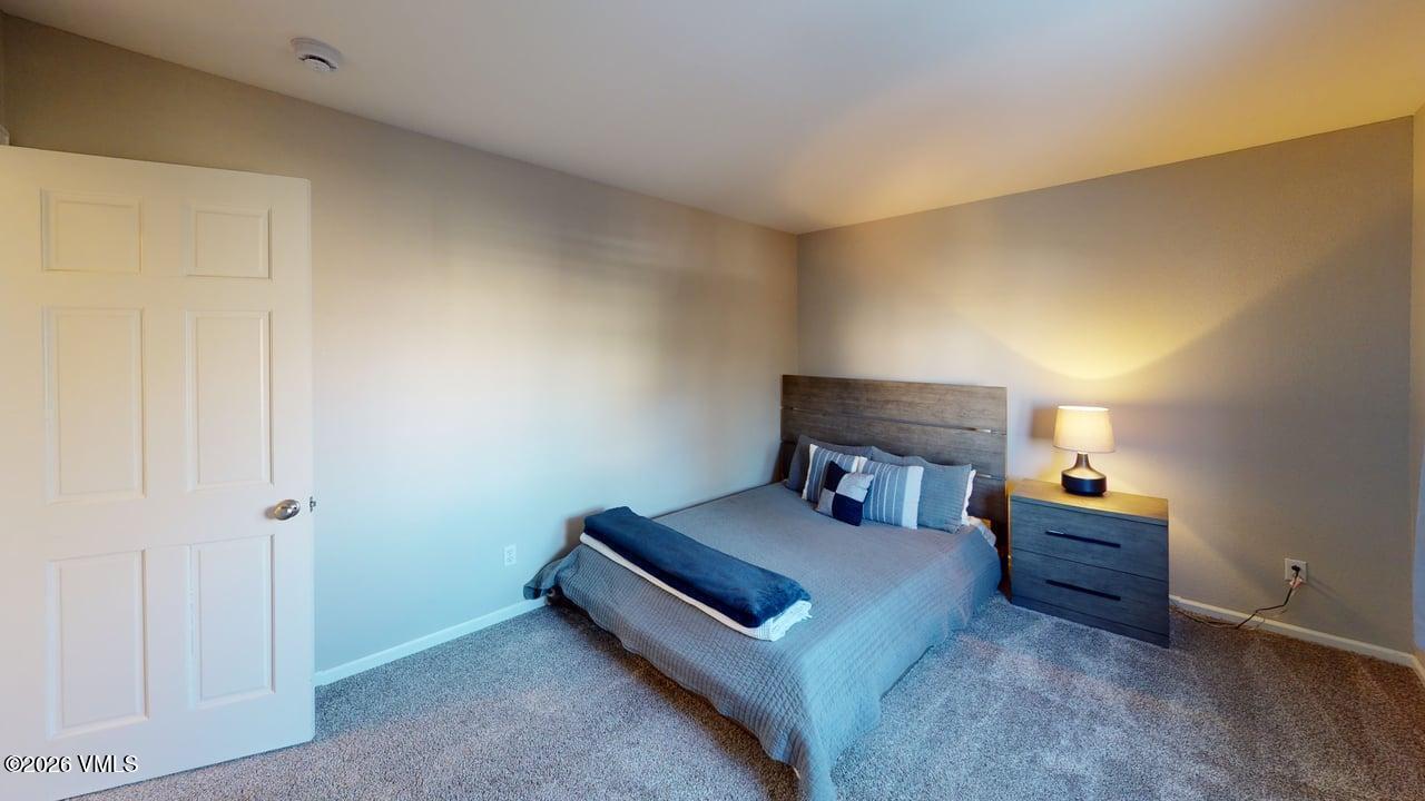 8958 South Forrest Drive Littleton, CO 80126 - Photo 10 of 27 a living room with furniture and a lamp