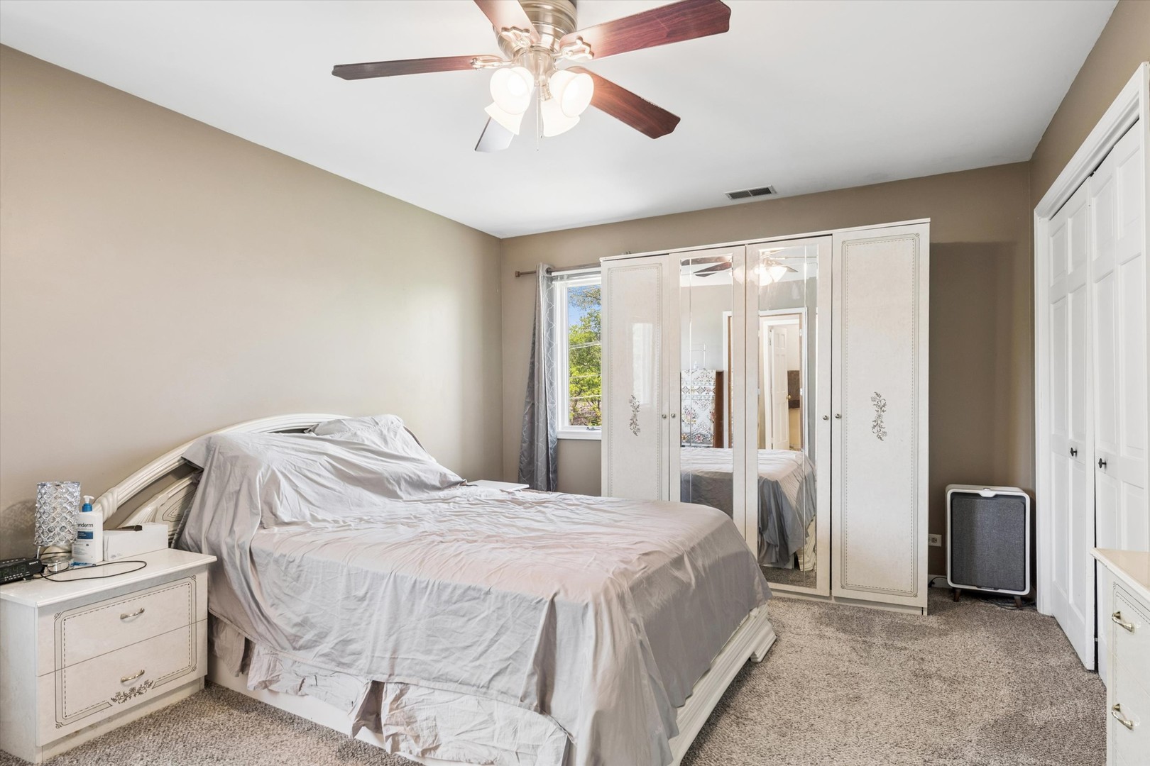 2142 North Summit Street Wheaton, IL 60187 - Photo 18 of 35 a bedroom with a bed and a chandelier