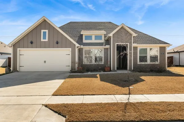 a front view of a house with yard