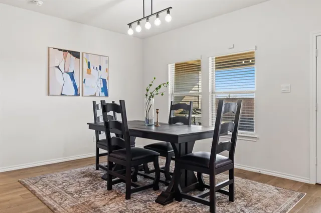 a view of a dining room with furniture