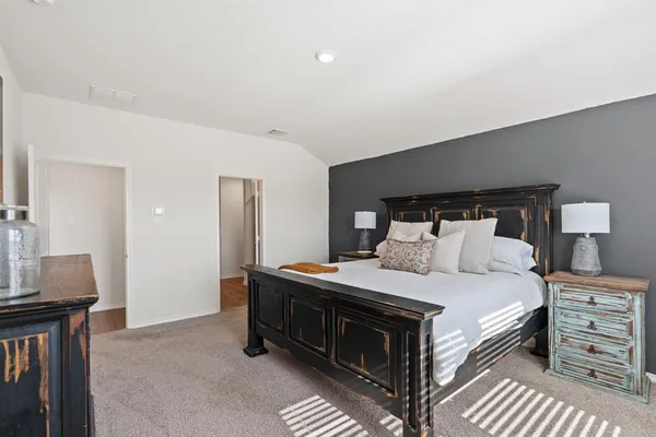 a view of bathroom with a sink mirror and shower