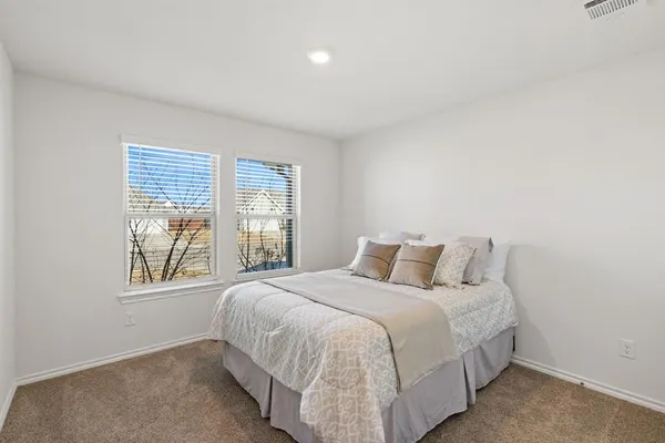 a living room with furniture a couch and a flat screen tv