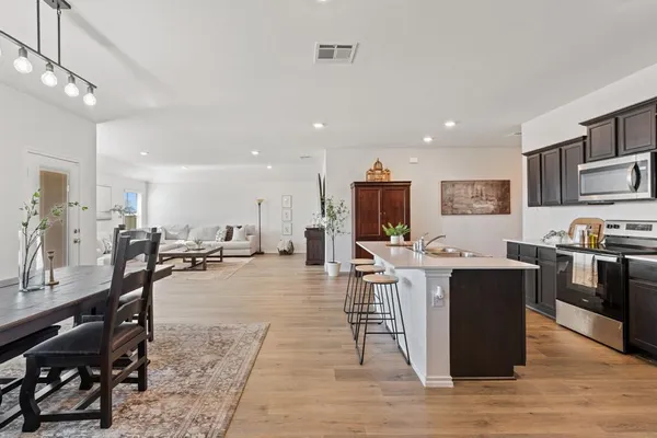 a view of a dining room with furniture window and wooden floor