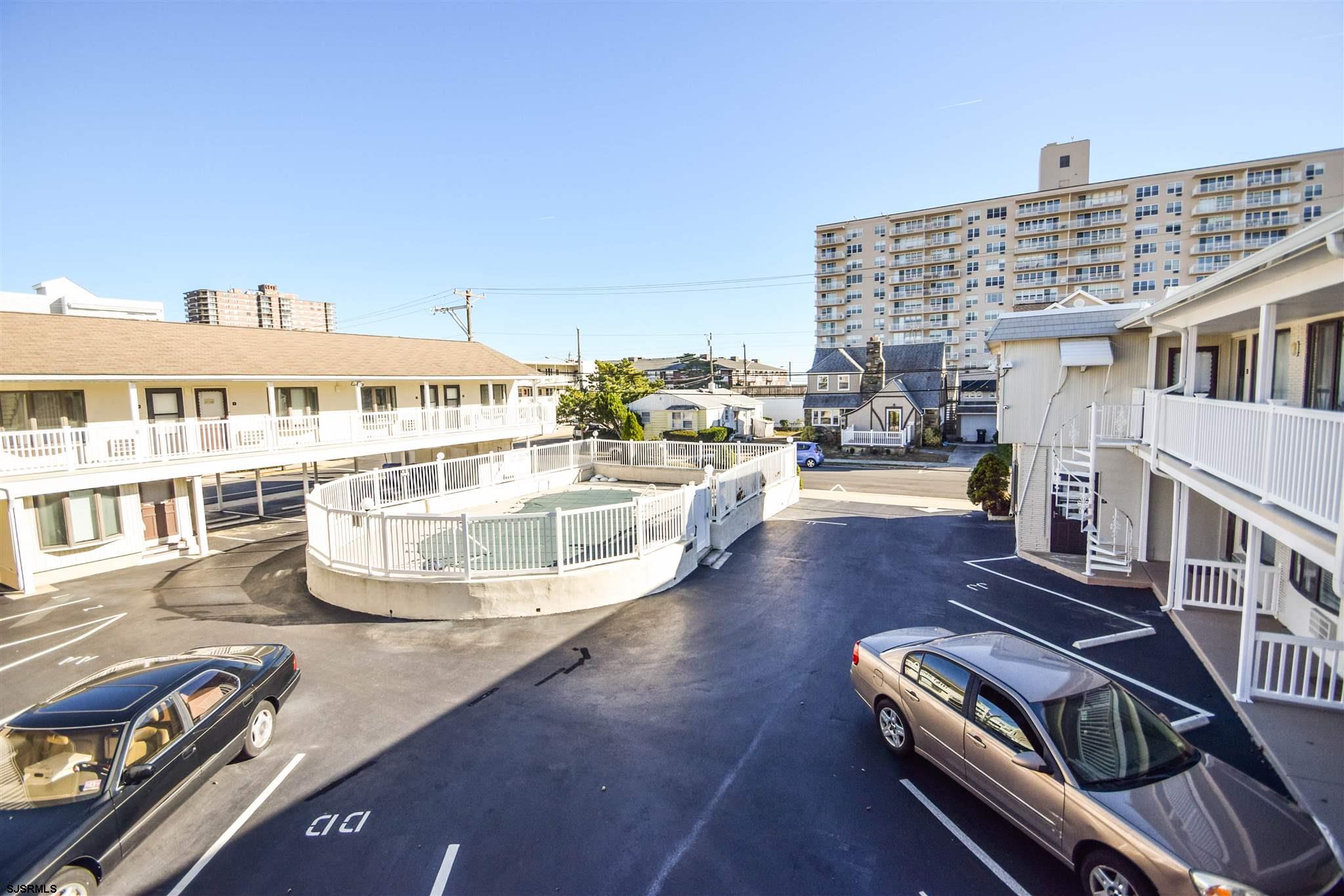 9401 Pacific Avenue, Unit 8 Margate City, NJ 08402 - Photo 1 of 8 a view of a balcony with chairs