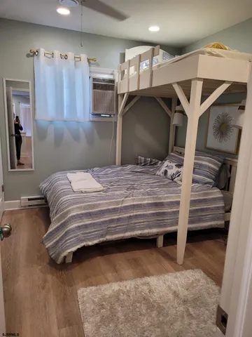 a bedroom with a bed and a walk in closet