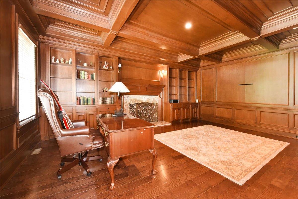 1616 Stewart Lane Syosset, NY 11791 - Photo 14 of 38 Office area featuring crown molding, a wooden ceiling with exposed beams, built in features, and dark wood-style floors