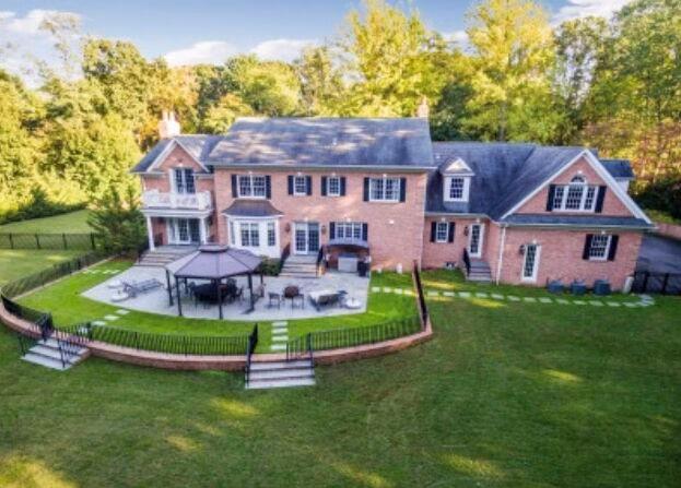 1616 Stewart Lane Syosset, NY 11791 - Photo 2 of 38 Rear view of house with entry steps, a fenced backyard, a patio, and a gazebo