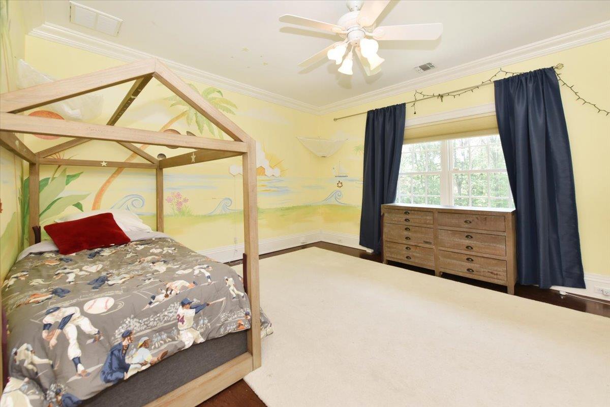 1616 Stewart Lane Syosset, NY 11791 - Photo 27 of 38 Bedroom featuring ornamental molding, a ceiling fan, and carpet floors