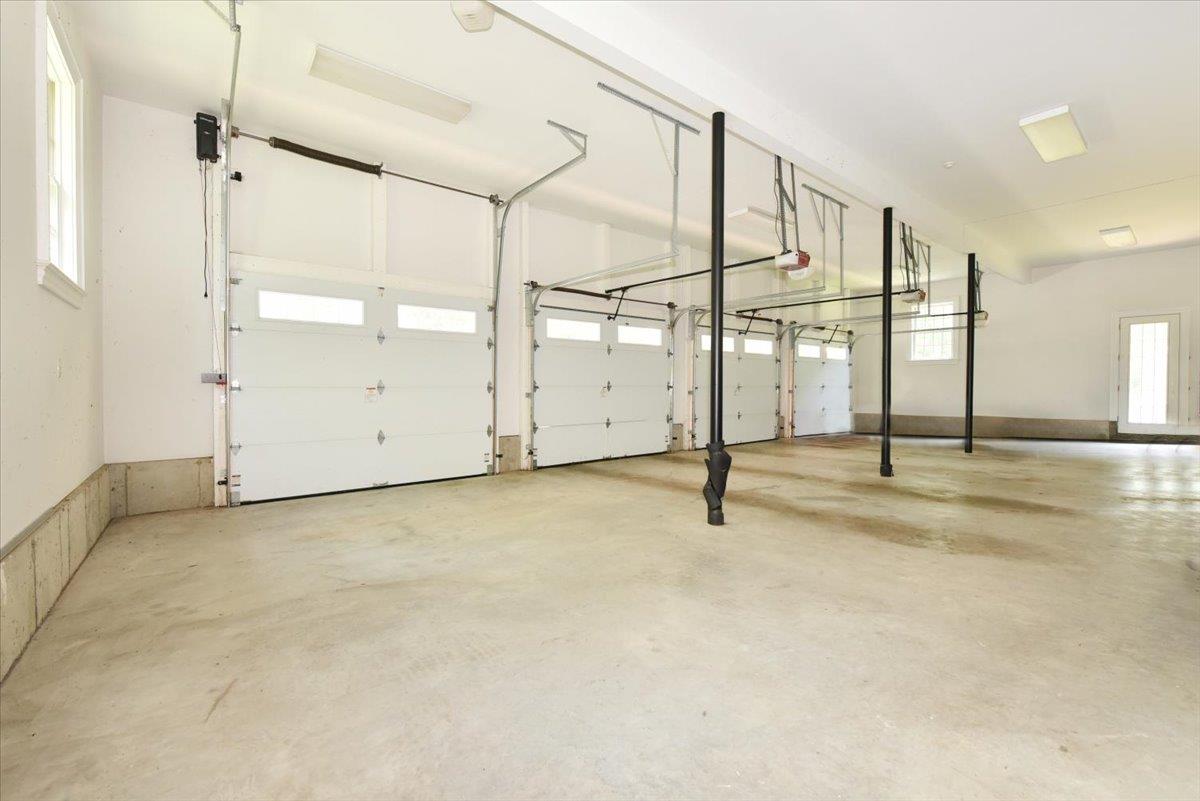 1616 Stewart Lane Syosset, NY 11791 - Photo 31 of 38 Garage featuring a garage door opener