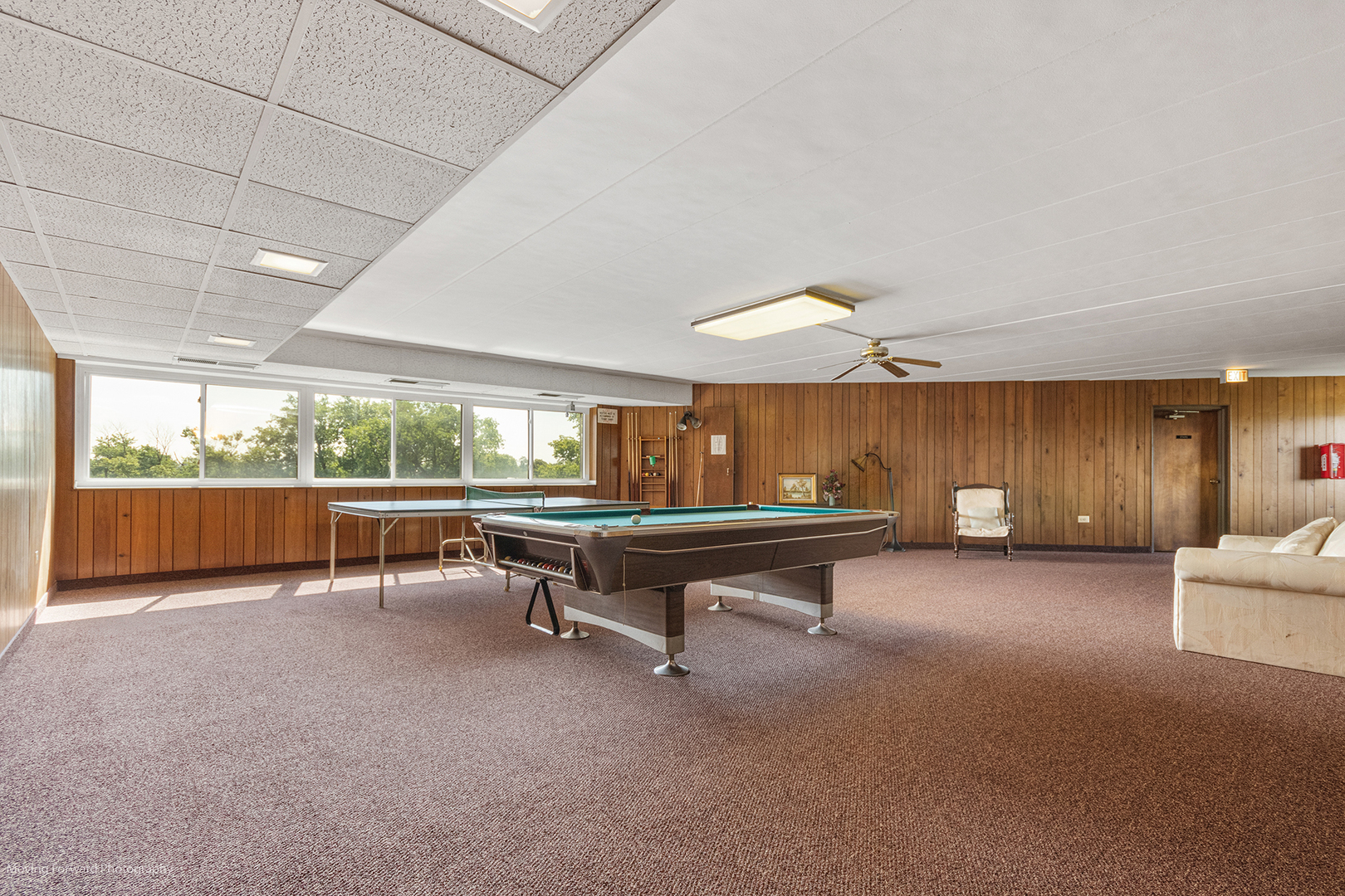 2900 Maple Avenue, Unit 13C Downers Grove, IL 60515 - Photo 34 of 36 a view of a room with gym equipment and large windows