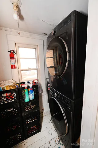 a kitchen with stainless steel appliances a refrigerator sink and stove
