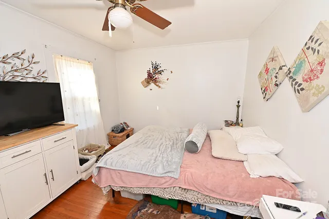 a bedroom with furniture and a rug