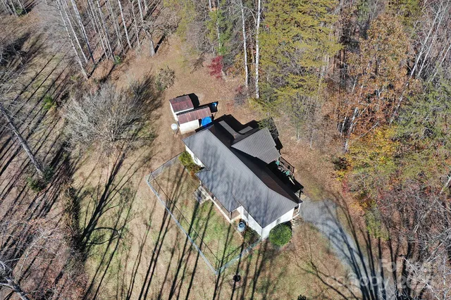 a view of a house with a tree