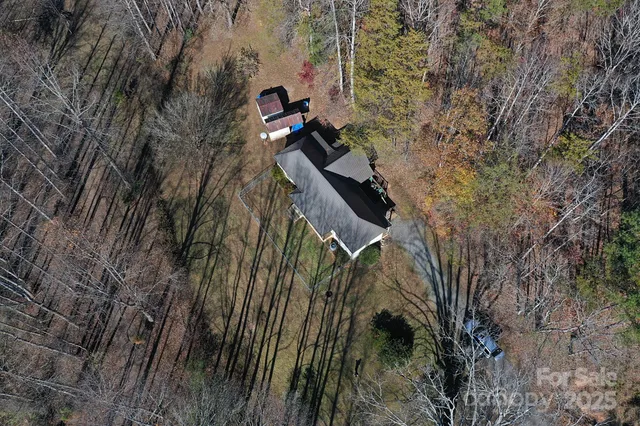 an aerial view of a house with outdoor space