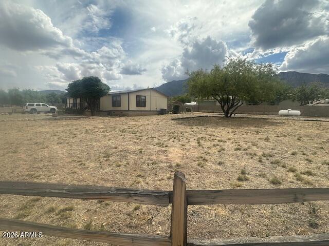 7258 South Lariat Road Hereford, AZ 85615 - Photo 23 of 37 a view of a yard with wooden fence