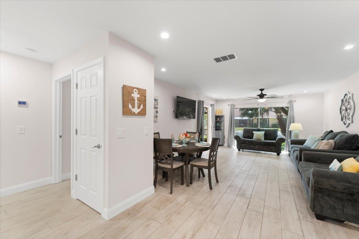 3960 A1A South St. Augustine, FL 32080 - Photo 12 of 44 a living room with furniture and wooden floor