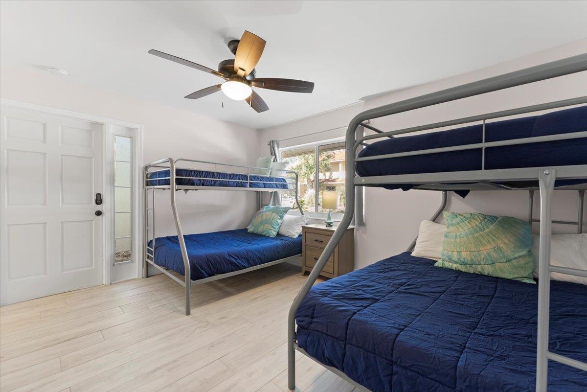 3960 A1A South St. Augustine, FL 32080 - Photo 21 of 44 a bedroom with a bed and a ceiling fan