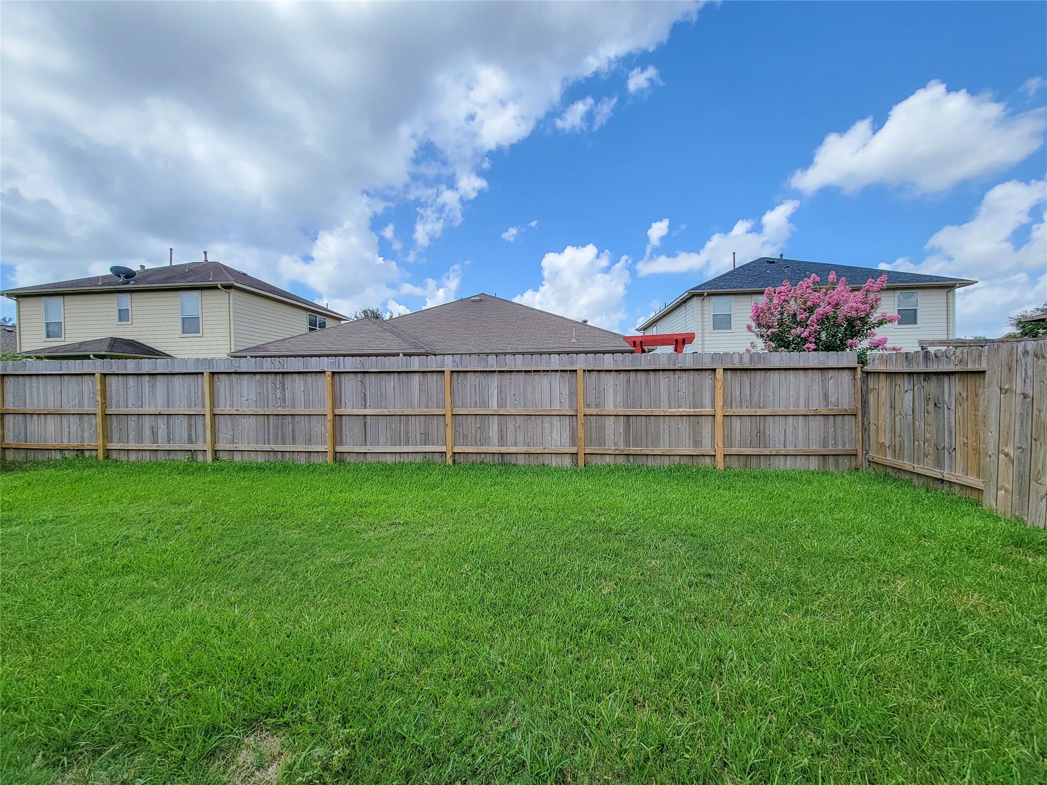 25223 Hazel Ranch Drive Katy, TX 77494 - Photo 16 of 20 a view of a house with a yard and wooden fence
