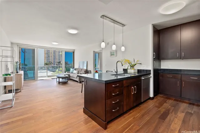 a kitchen with a sink and cabinets