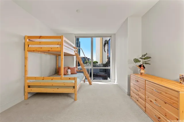 a bedroom with furniture and a potted plant