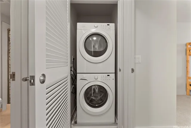 a close view of a utility room with dryer and washer