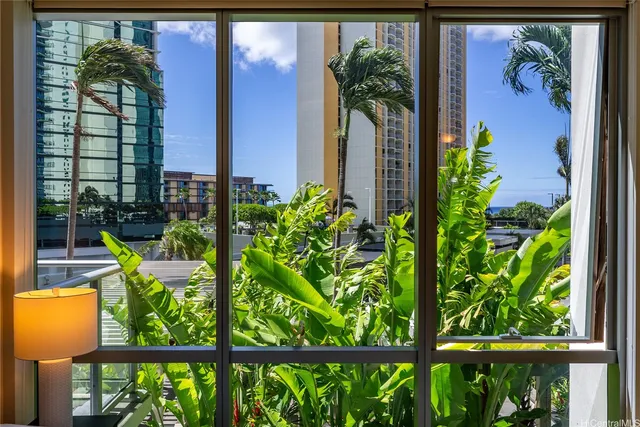 a view of a potted plants next to a wall