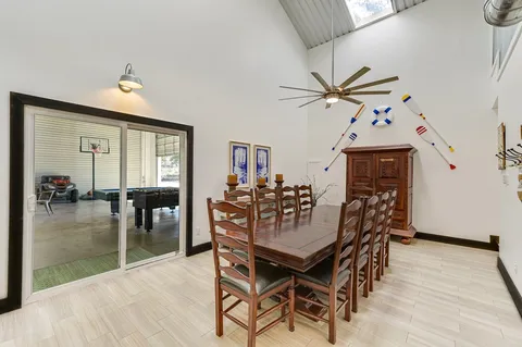 a dining room with furniture and window