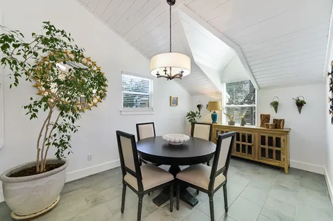 a balcony with furniture and wooden floor
