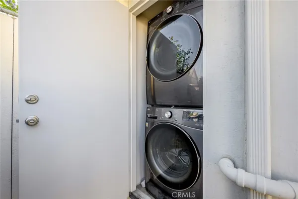 a close view of a utility room with dryer and washer