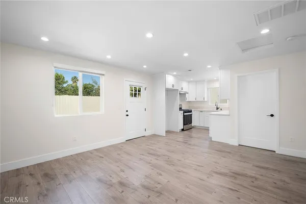 a view of kitchen with wooden floor