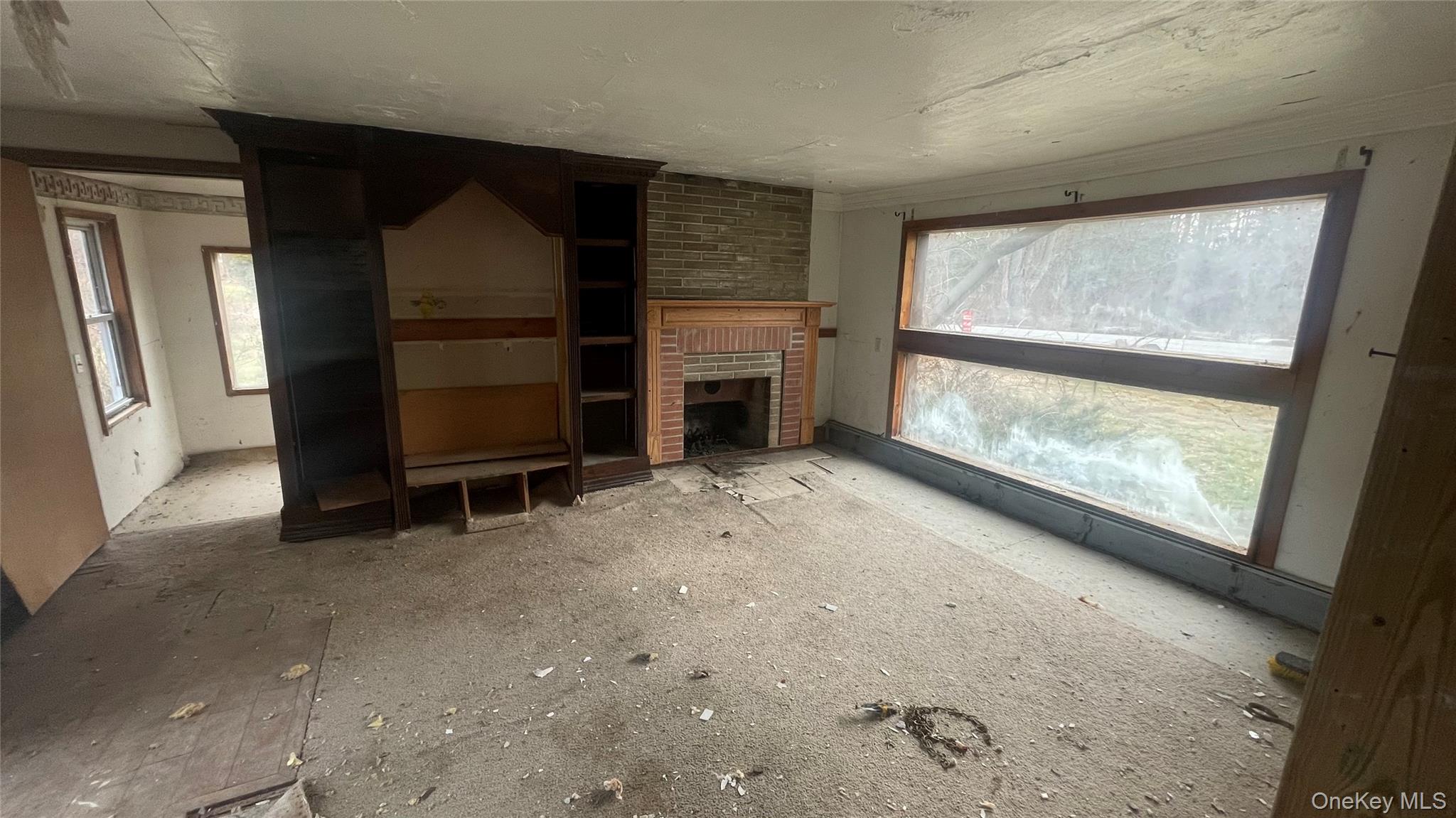 10 Fawn Road Saugerties, NY 12477 - Photo 10 of 15 a view of empty room with a fireplace and window
