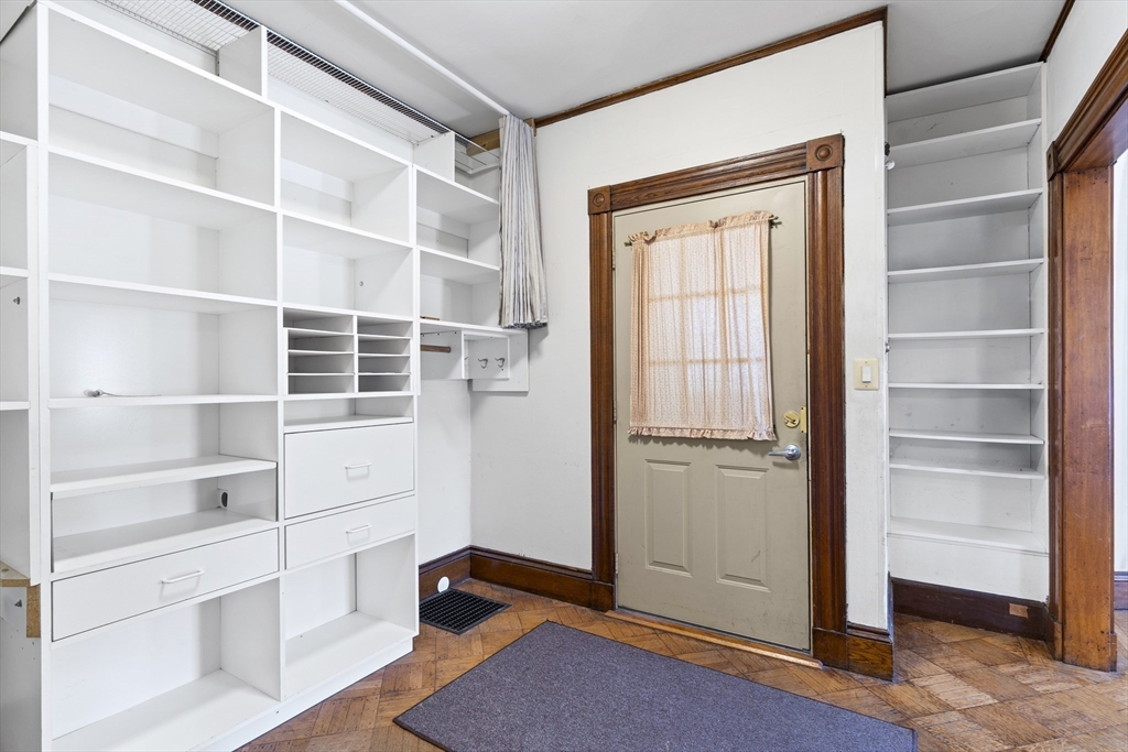 10 Alcott Street Boston, MA 02134 - Photo 11 of 36 a view of an empty room with empty shelves