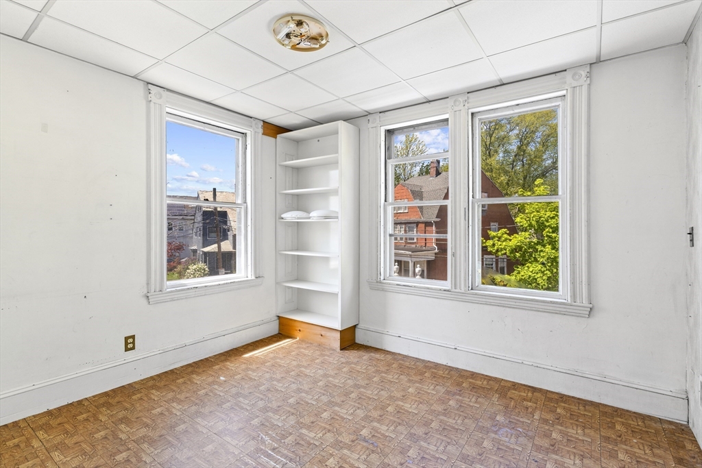 10 Alcott Street Boston, MA 02134 - Photo 13 of 36 an empty room with windows