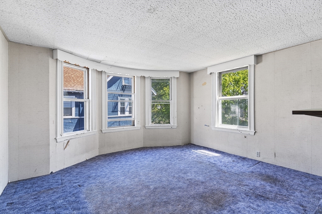 10 Alcott Street Boston, MA 02134 - Photo 16 of 36 an empty room with windows