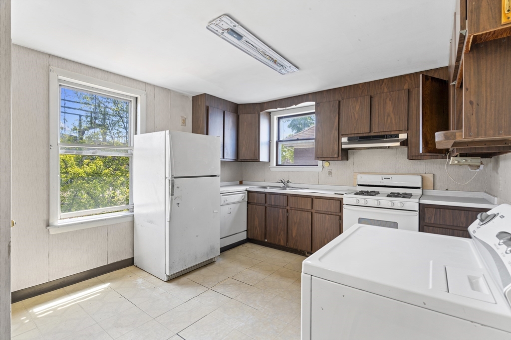 10 Alcott Street Boston, MA 02134 - Photo 18 of 36 a kitchen with a refrigerator stove and sink