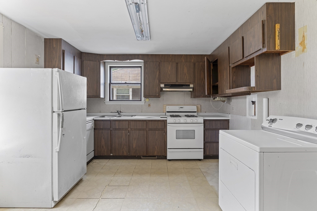 10 Alcott Street Boston, MA 02134 - Photo 19 of 36 a kitchen with a refrigerator sink and stove
