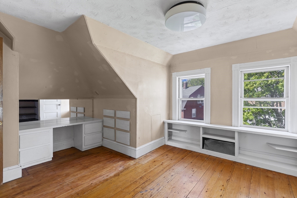 10 Alcott Street Boston, MA 02134 - Photo 22 of 36 a view of wooden floor and windows in a room