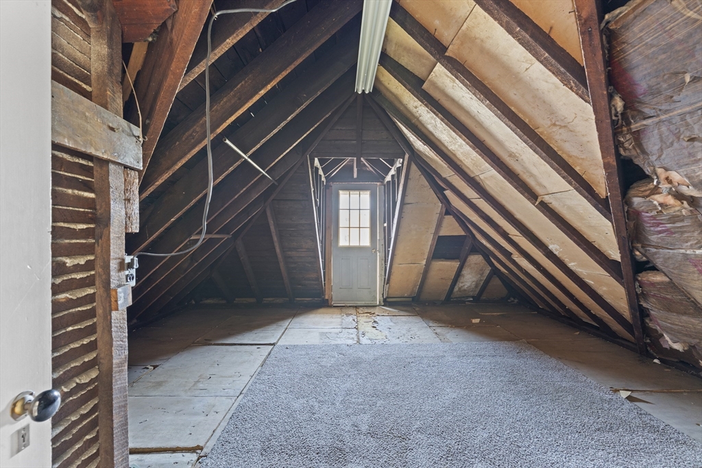 10 Alcott Street Boston, MA 02134 - Photo 25 of 36 a view of an empty room with stairs and a large tree