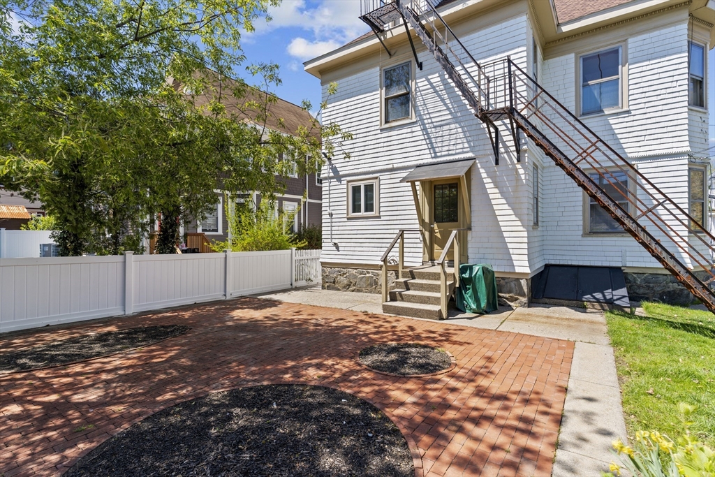 10 Alcott Street Boston, MA 02134 - Photo 30 of 36 a view of a house with a yard