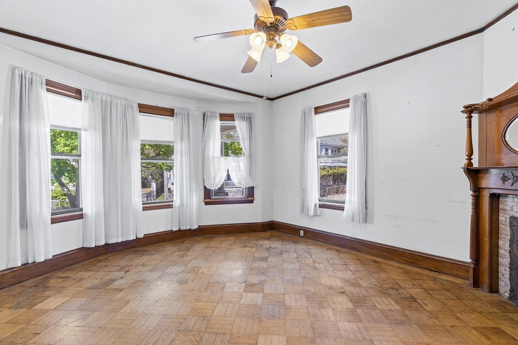 10 Alcott Street Boston, MA 02134 - Photo 3 of 36 a view of an empty room with a window