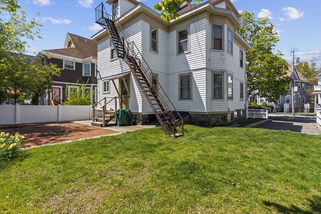 10 Alcott Street Boston, MA 02134 - Photo 31 of 36 a view of a house with a yard and sitting area