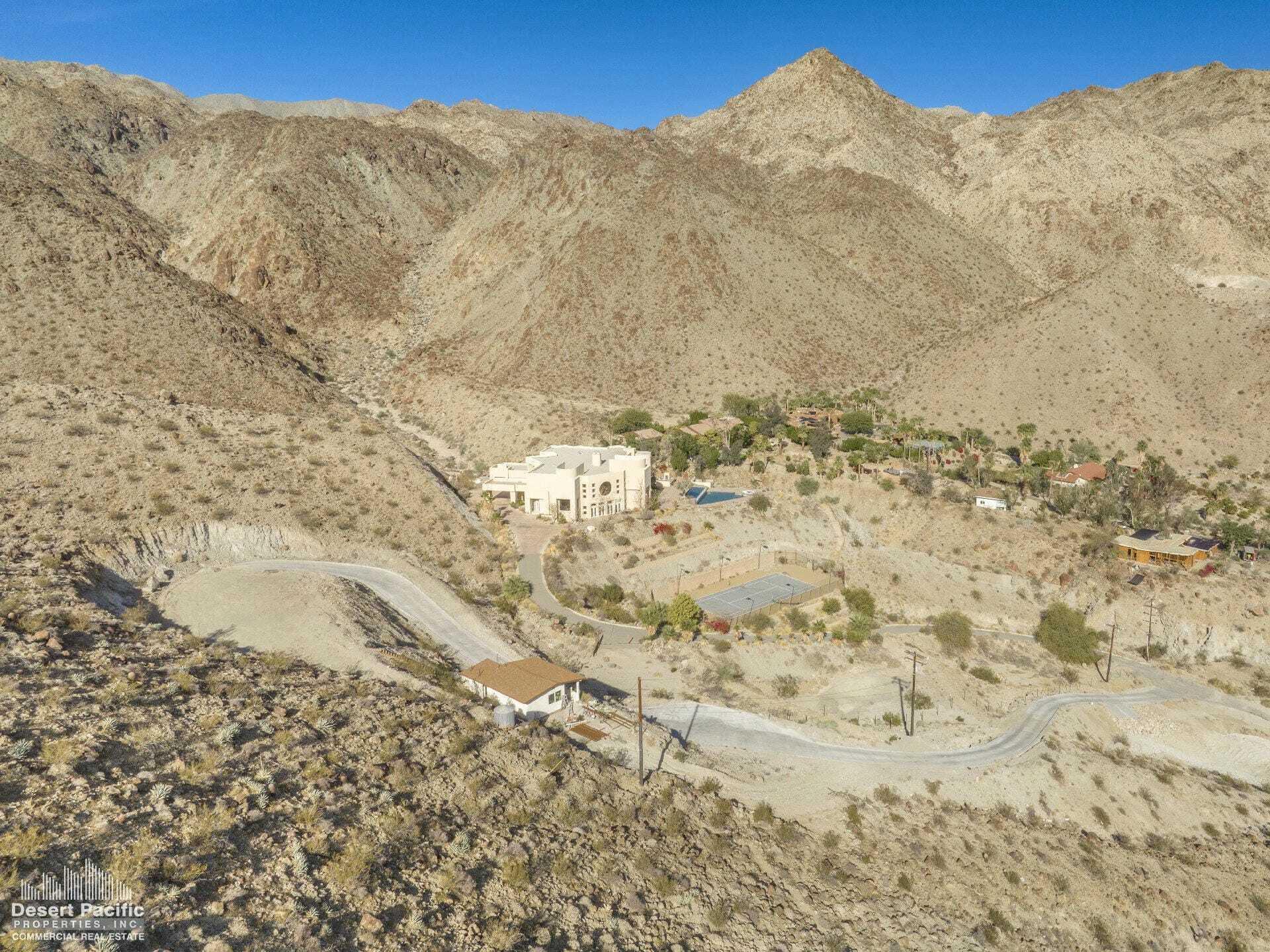 0 Cholla Way Palm Desert, CA 92260 - Photo 13 of 22 a view of a dry yard with mountains in the background