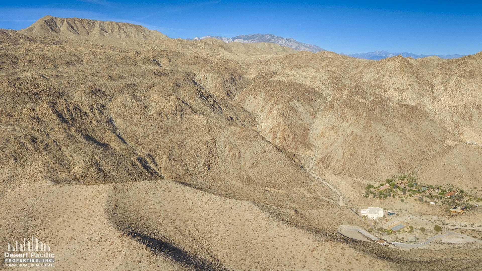 0 Cholla Way Palm Desert, CA 92260 - Photo 20 of 22 a view of a dry yard with mountains in the background