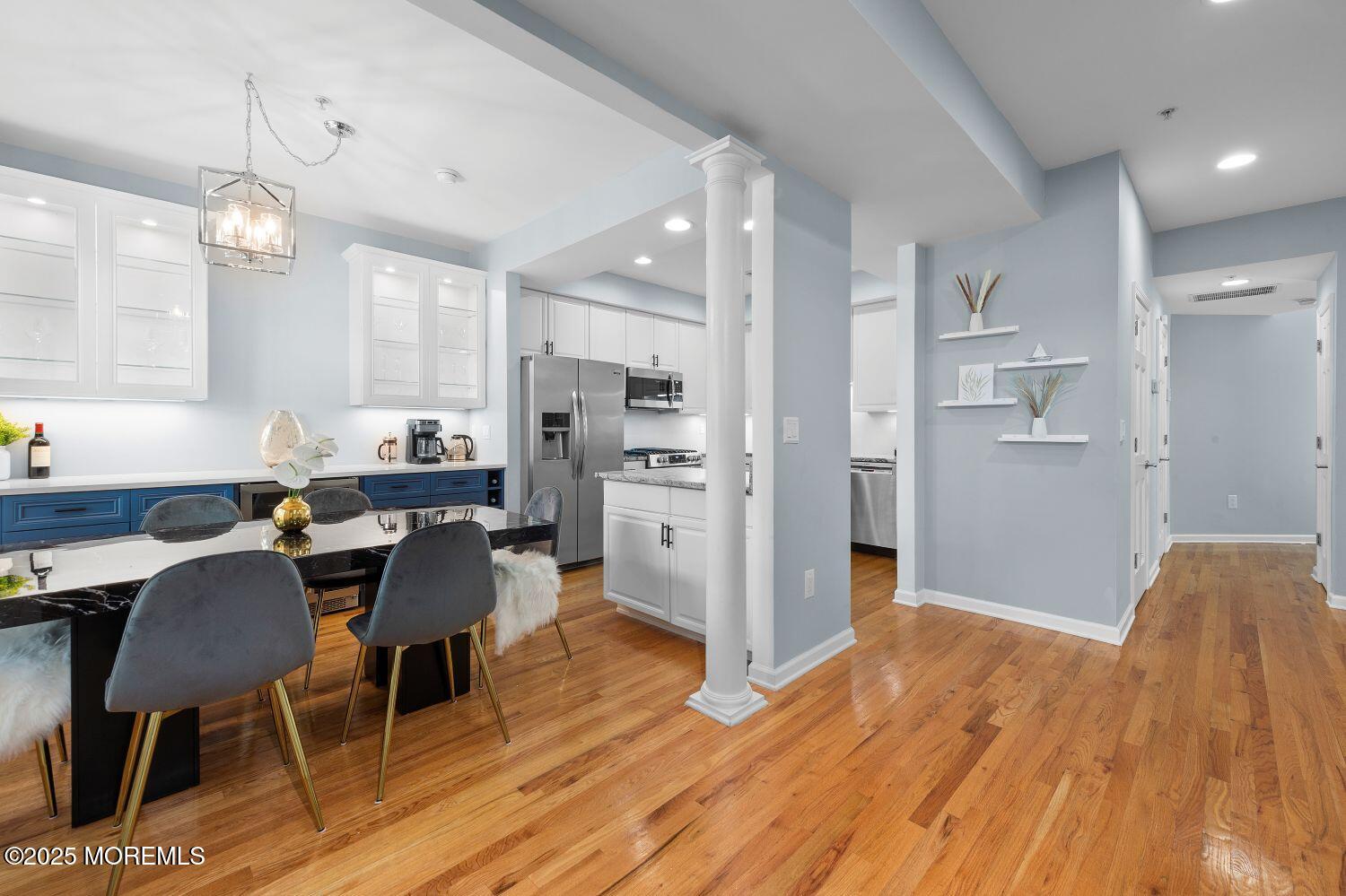 162 Main Street Manasquan, NJ 08736 - Photo 15 of 48 a view of a dining room with furniture and wooden floor