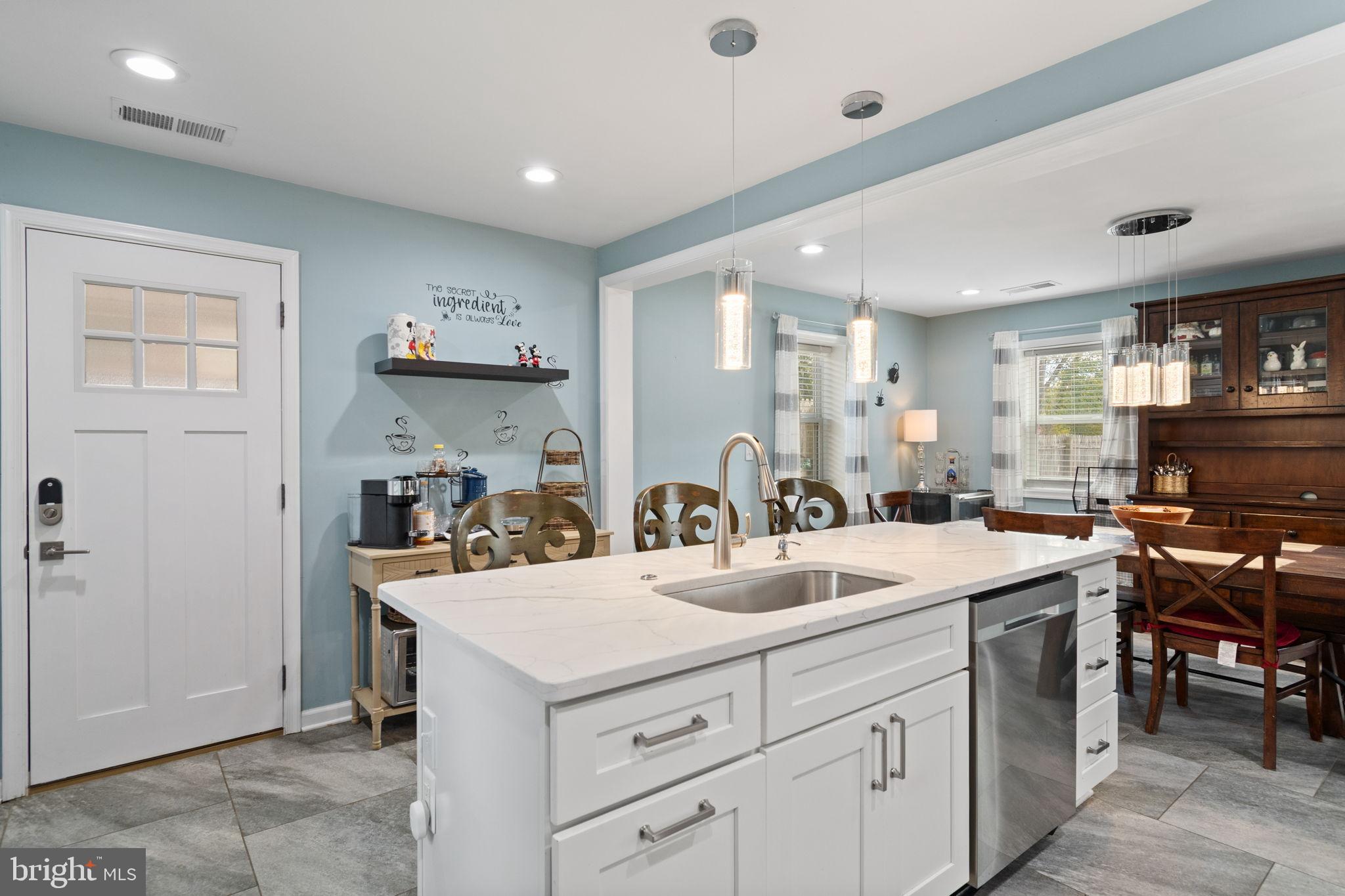 608 Blue Ridge Avenue Northeast Leesburg, VA 20176 - Photo 12 of 36 a kitchen with a sink a stove and cabinets